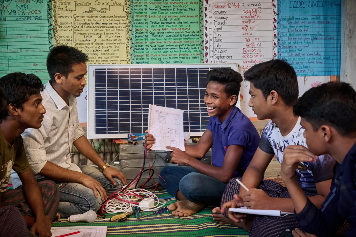 Nur Mohammad, 13, demonstrates the skills he learned from a vocational skills training on electrical work and solar panel repair at a multi-purpose centre in the Rohingya refugee camps in Cox&rsquo;s Bazar, Bangladesh.