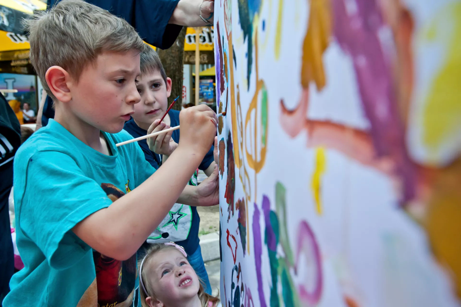 Children are painting on a canvas on the 15th of May 20105, in the city of Berane , Montenegro