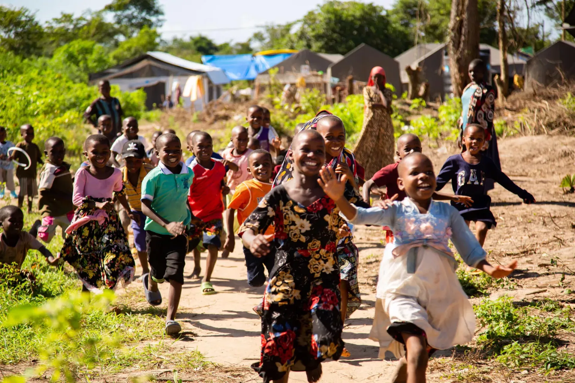 Children playing outside a UNICEF-provided education tent.
