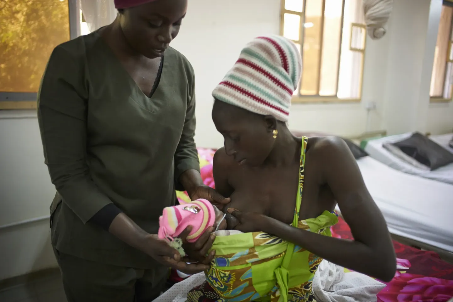 Nyima Jarju breastfeeds her baby Abbie at the Kangaroo Mother Care Ward of the Edward Francis Small Teaching Hospital in Banjul.