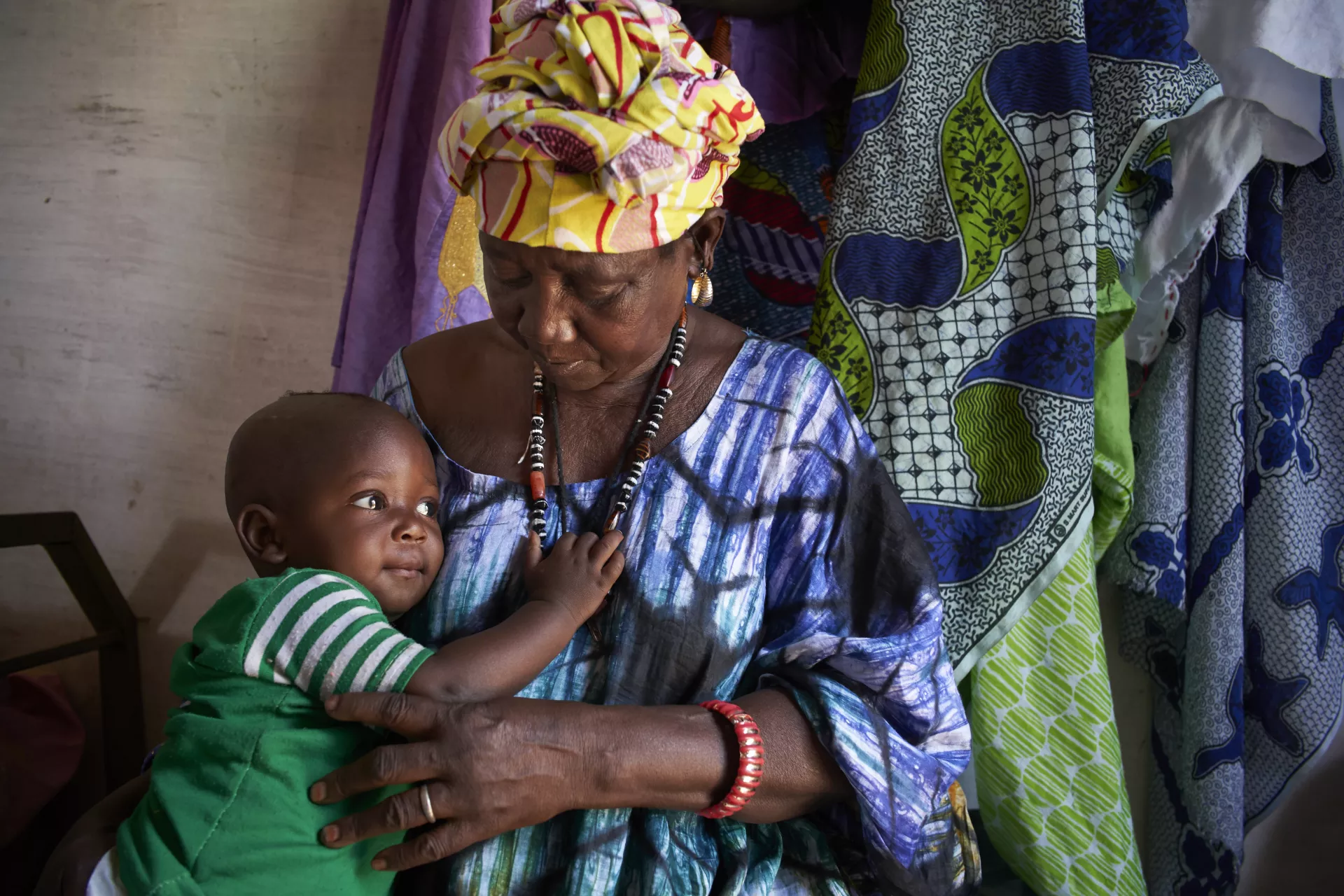 Little boy plays with his grandmother