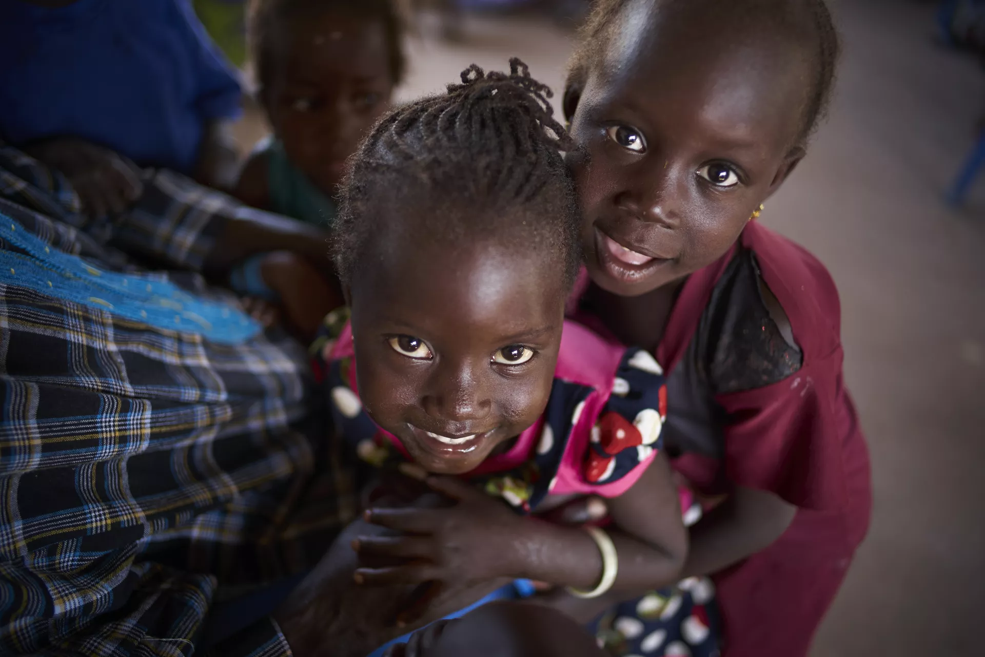 Two children smile for the camera