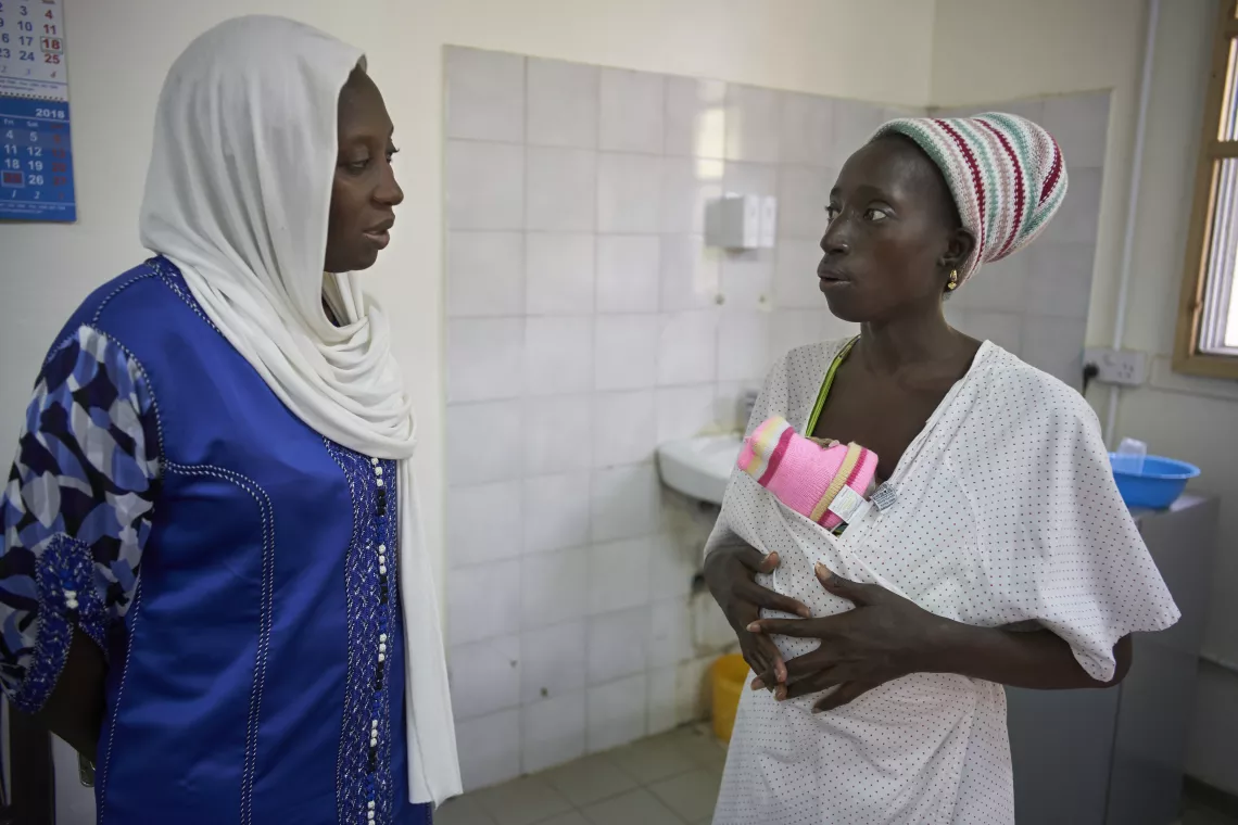 UNICEF staff speaks to mother admitted in Kangaroo Mother Care Unit 