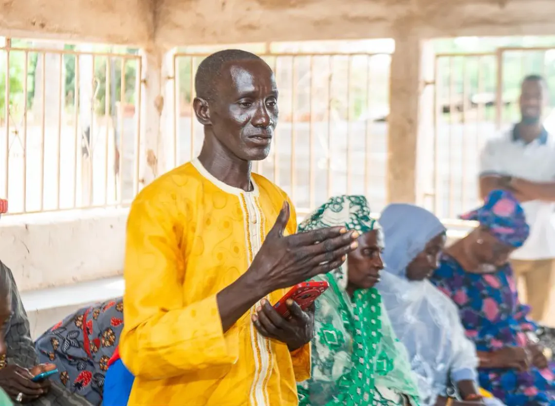 Alkalo Sherifo Sanneh, addressing his village members during the creation of the Mama Kafoo. 