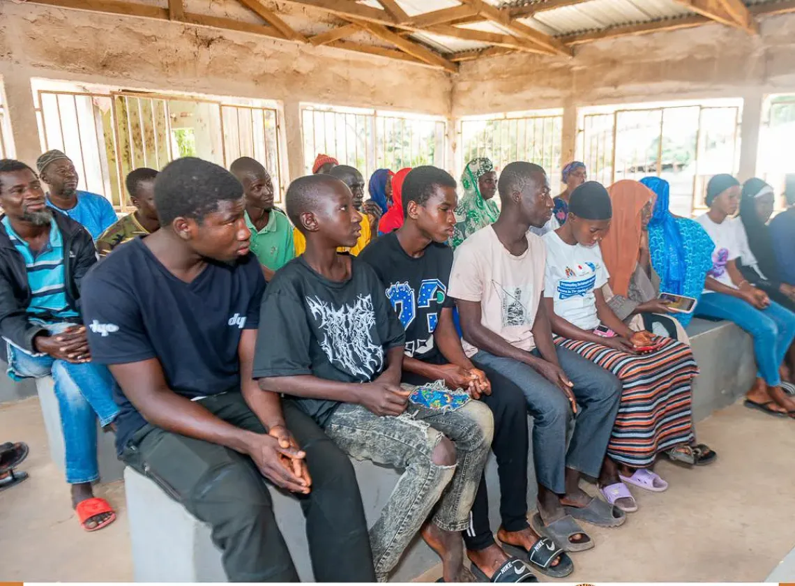 Lamin and his peers listening keenly at the inauguration ceremony of the Mama Kafoo in Kolior.