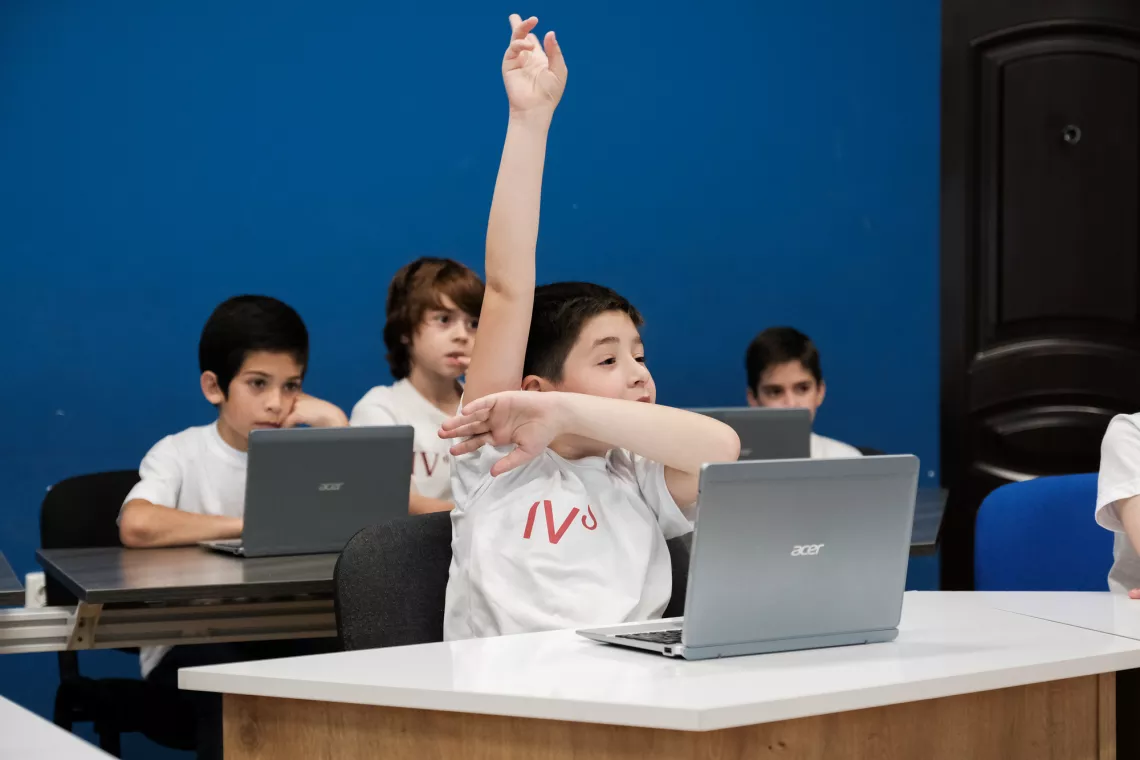 boy holds his hands up