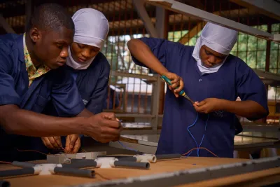A girl from St. Mary&rsquo;s Vocational Institute in Tamale prepares thread for weaving during a practical textile session observed by UNICEF Ghana.