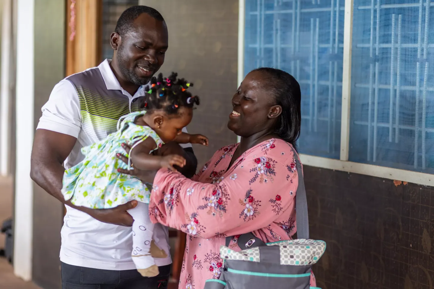 Claudia B. Woode and her family after a vaccination session, at the Holy Child Catholic Hospital, Takoradi.