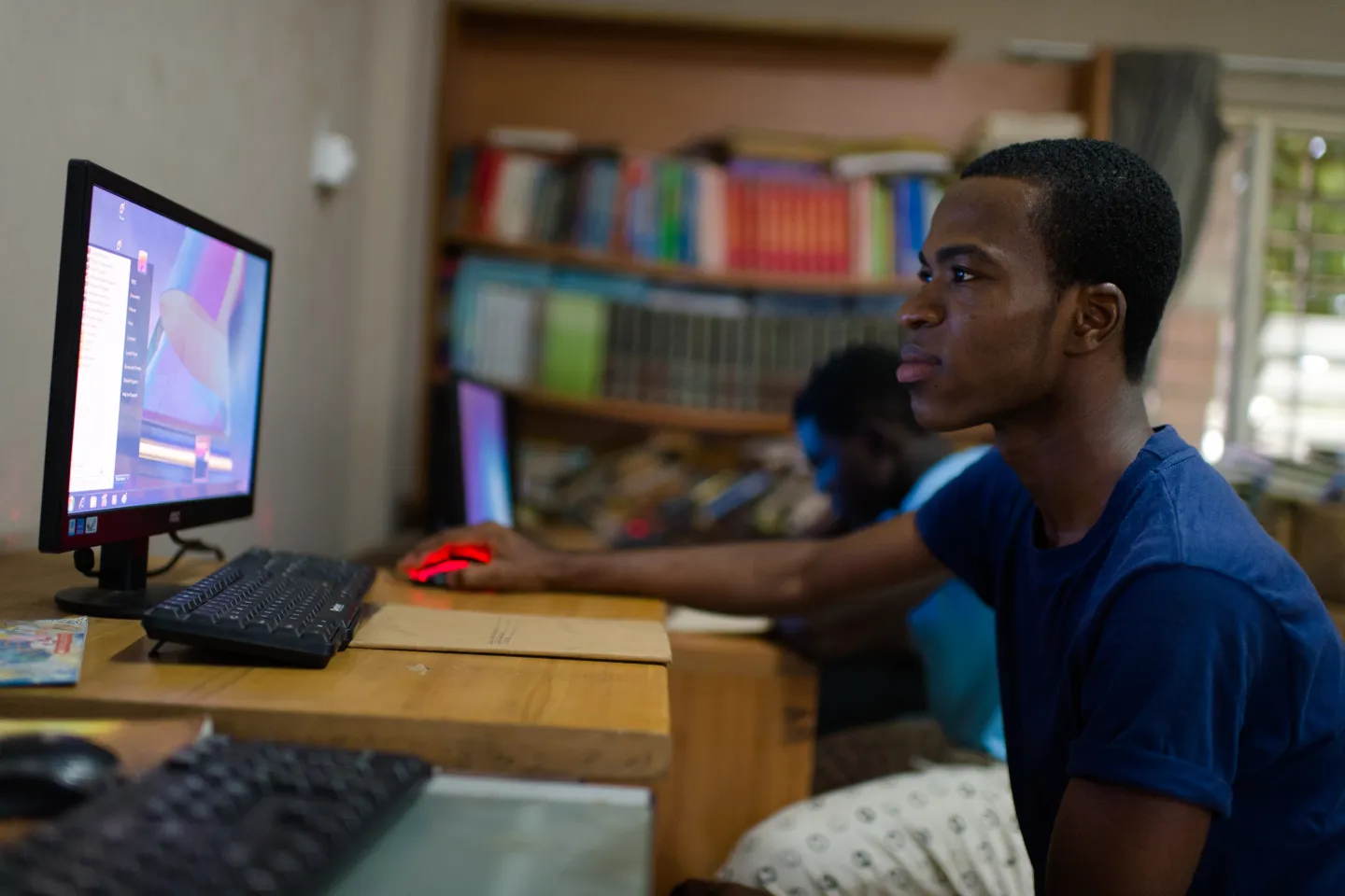 Emmanuel using a computer at the Osu Children's Home in Accra, Ghana in 5 May 2015.  