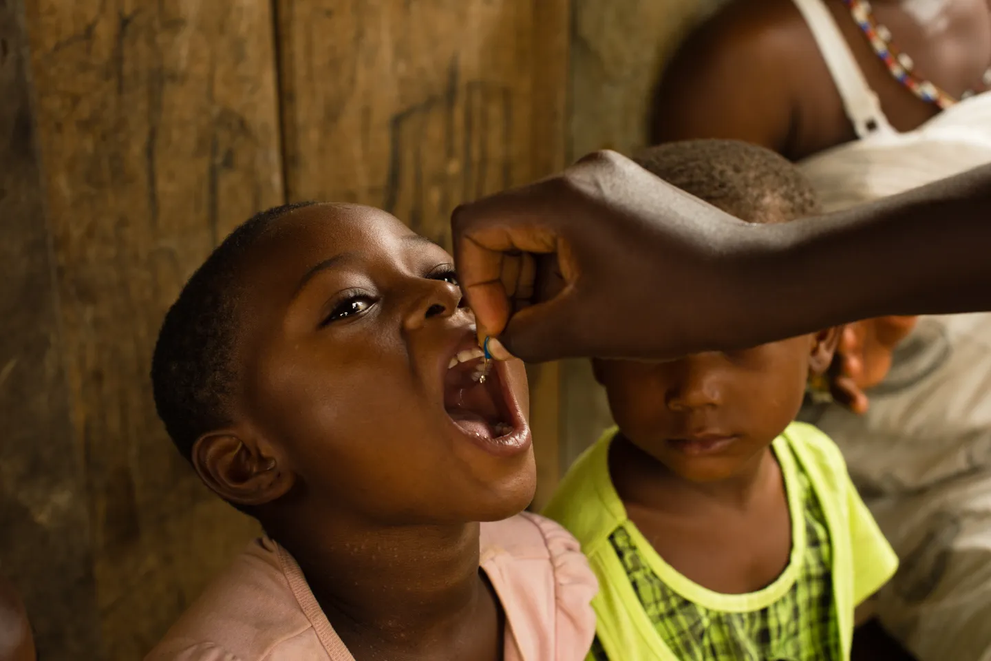 A child receiving a dose of vitamin A in the village of Kekereke in the Birim Central District of the Eastern Region of Ghana on 5 June 2013, during a National Immunization Days (NID) polio eradication campaign.