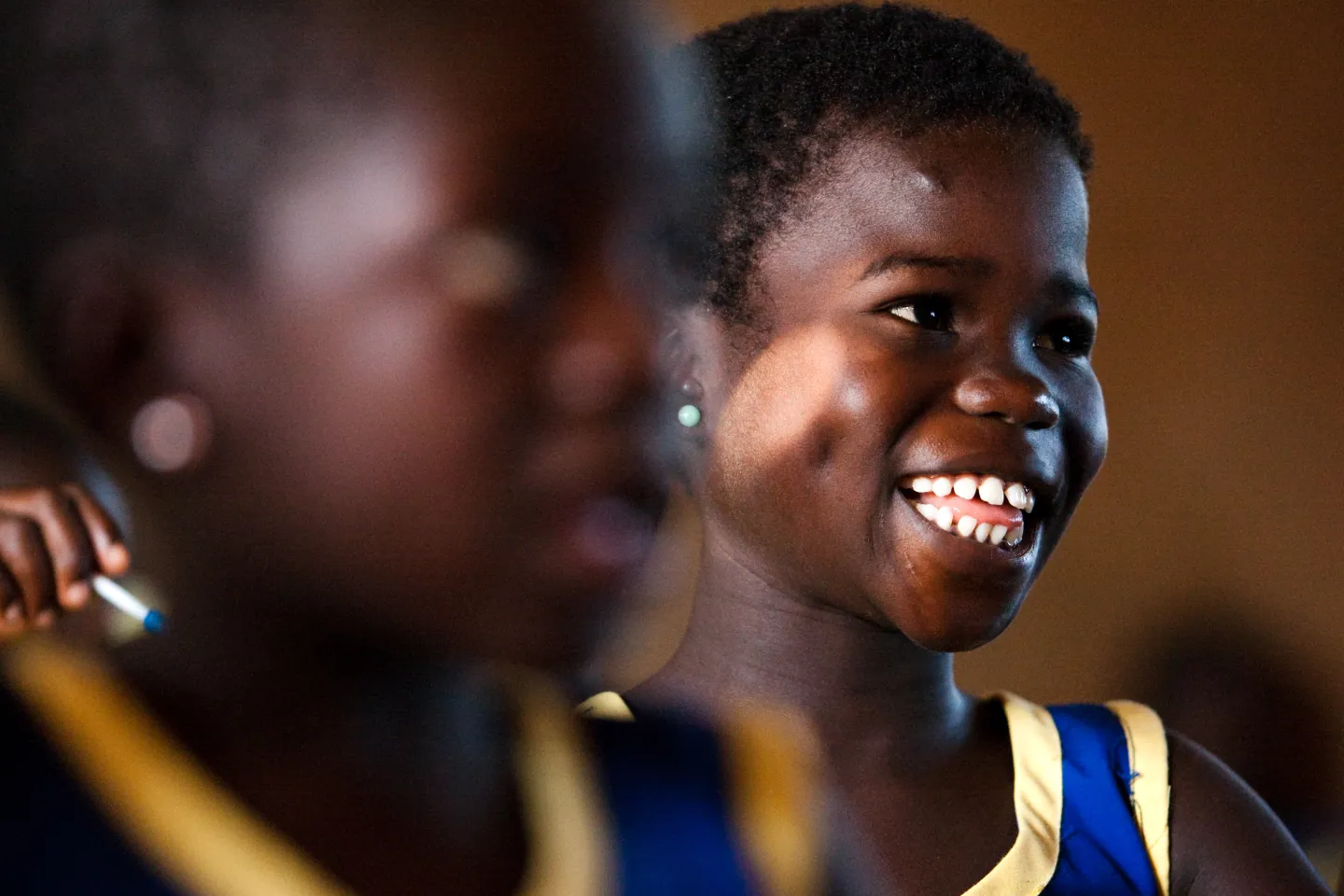 Girl smiling in a kindergarten class at the Moree Methodist primary school in the town of Moree, Ghana on Tuesday November 9, 2010.