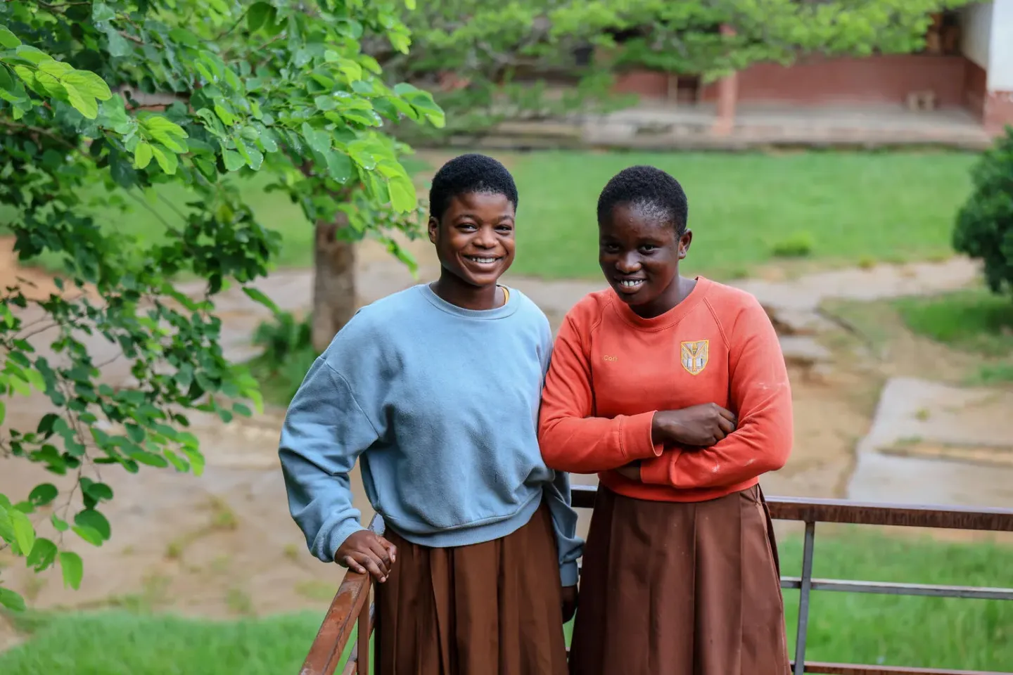 Two girls with smiles at the Ashanti School for the Deaf and Blind in Jamasi, Ashanti Region, Ghana.