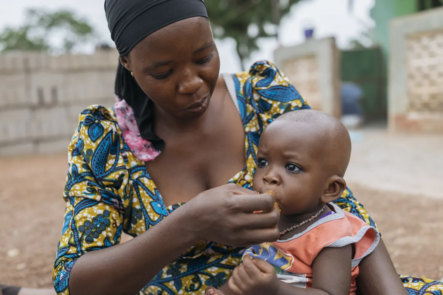 Adama feeds her son Saeed with fruits, meat and fish, depending on what is in season in Tolon, Ghana on 10 April 2018.