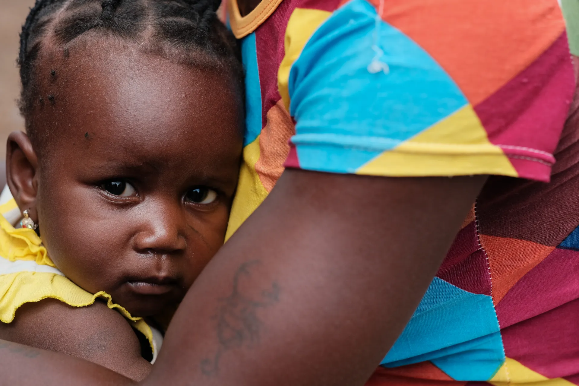 A child rest on her mothers chest
