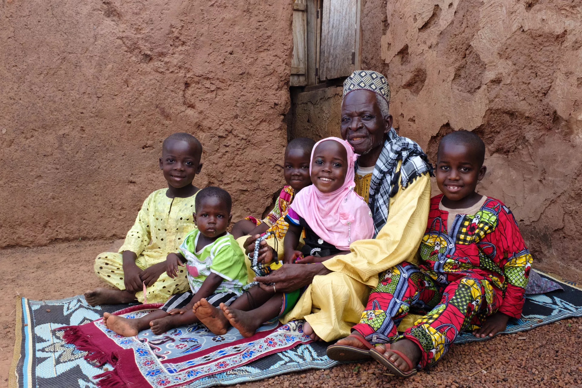 Zamigu Issah, the local Imam, with his children and grandchildren in the village of Kpano in the Northern Region of Ghana.