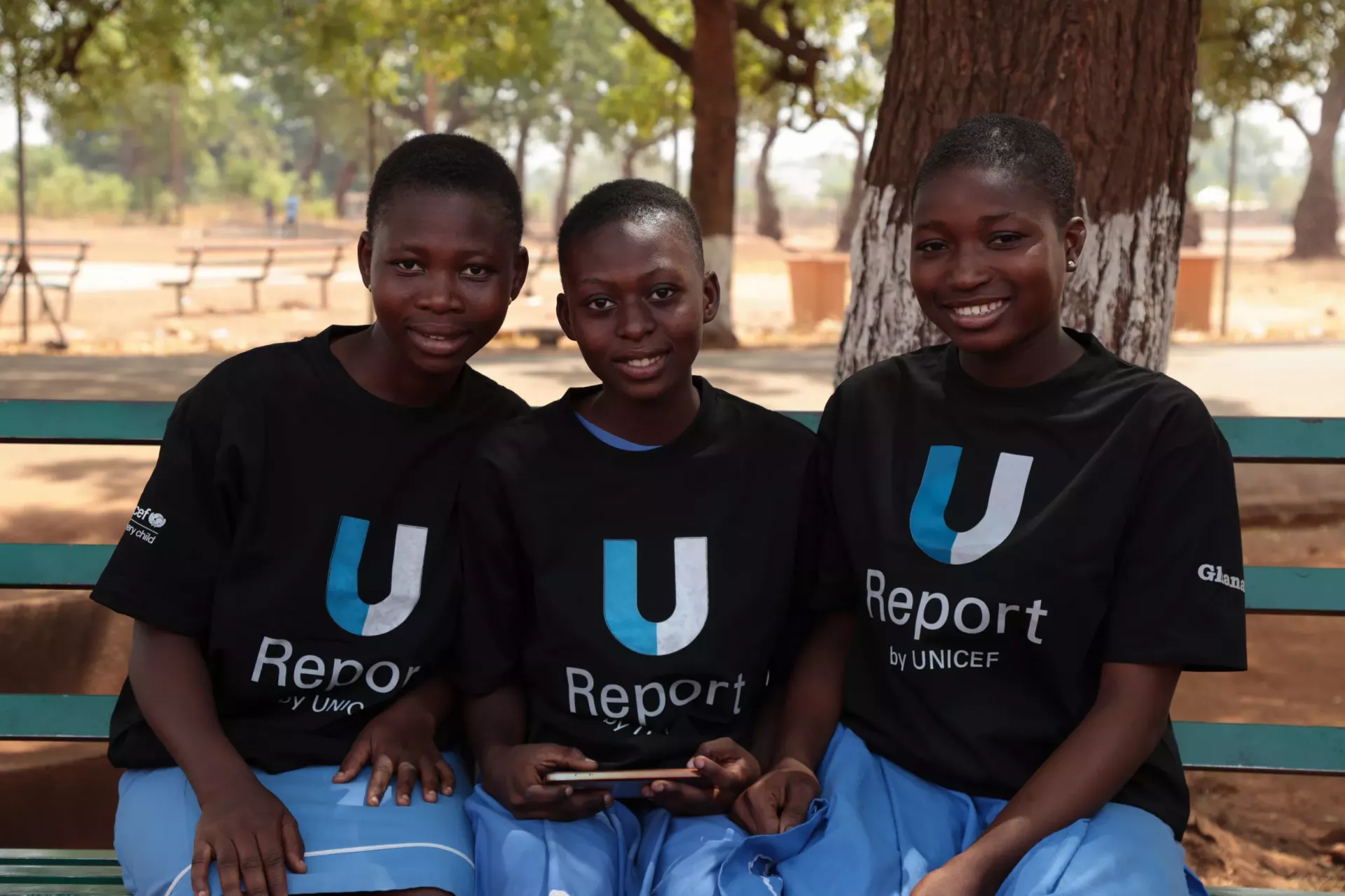 U-Reporters engage in a poll with smiles.