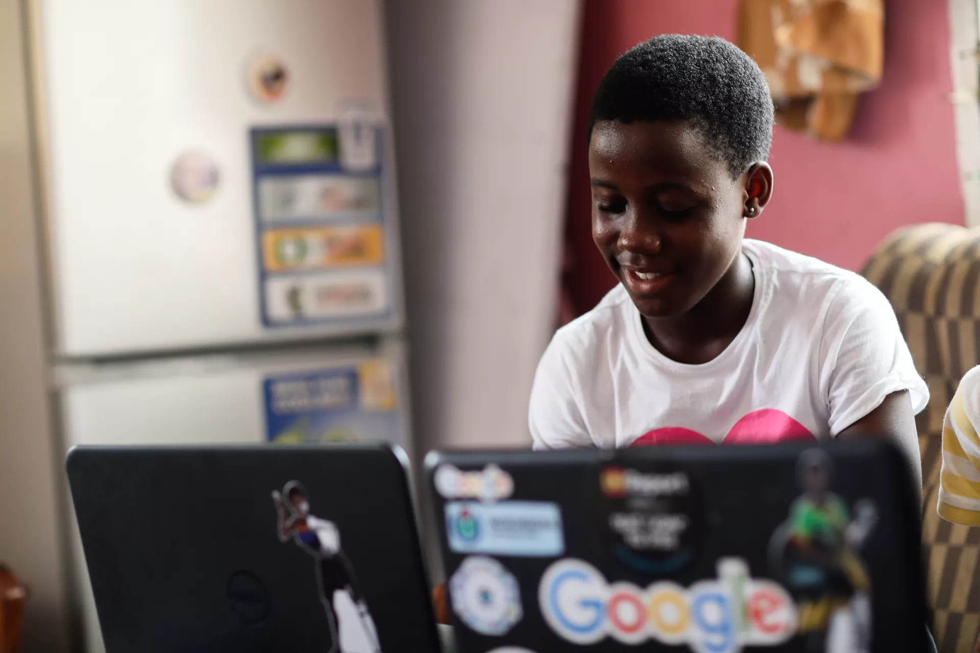  Winifred Asantewaa Asante, 15, is a first year student studying Clothing and Textiles at Ghana Senior High School, Efiduase, Koforidua using a laptop.