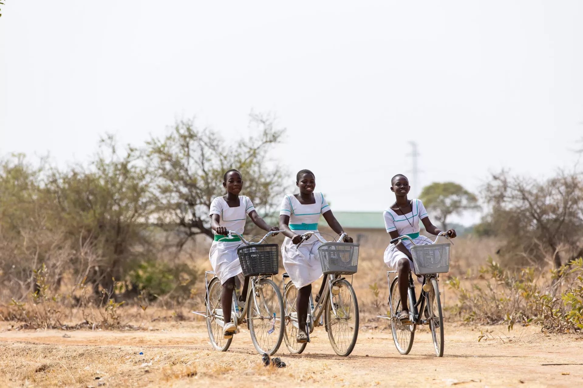 A group of young girls ridding to school
