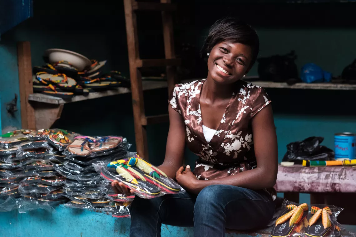 Josephine Abuyaa (20), a slipper and sandal maker at the Central Market in Kumasi, Ghana, on 26 January 2018.