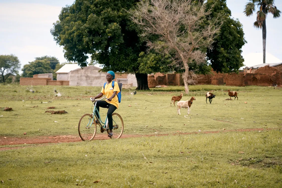 Before sitting down with expectant mothers in Gundoug/Mihiiboug, Aida Bugre, 34, covers ground on two wheels. Armed with a backpack of health guides, she travels across the community's rural terrain to ensure no one is left without healthcare.