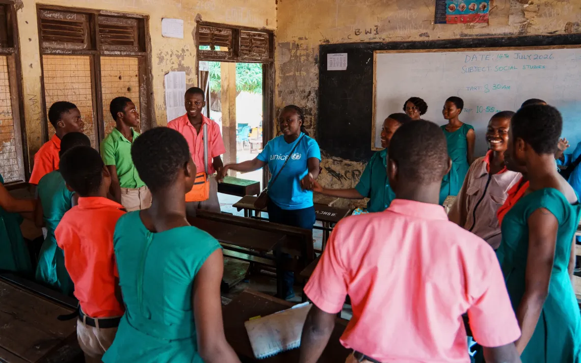 UNICEF Education Officer, Rhoda, engages students in play at the school.