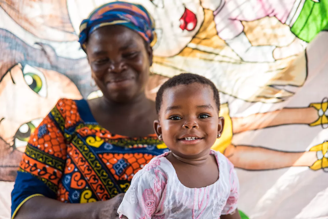 Christine Ayide on her mother&rsquo;s lap at Have-Jerusalem Volta Region 17 March 2016.