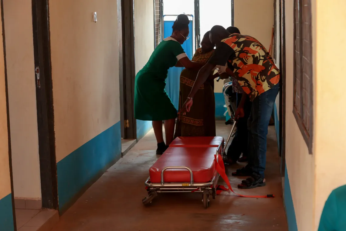 A pregnant woman is prepared for emergency referral at Bowku CHPS in the Upper East Region using a Modified Tricycle Ambulance provided through the KOICA-UNICEF initiative. 