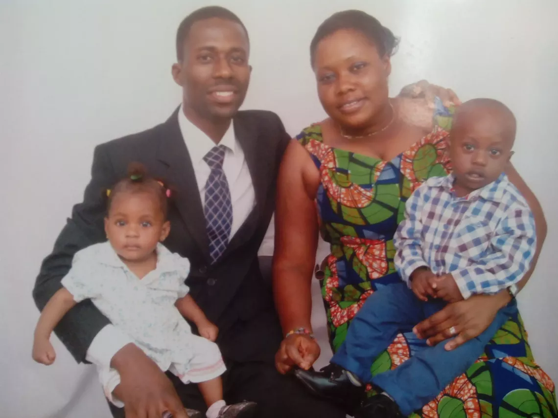A family portrait of Miriam with her husband and their two oldest children.