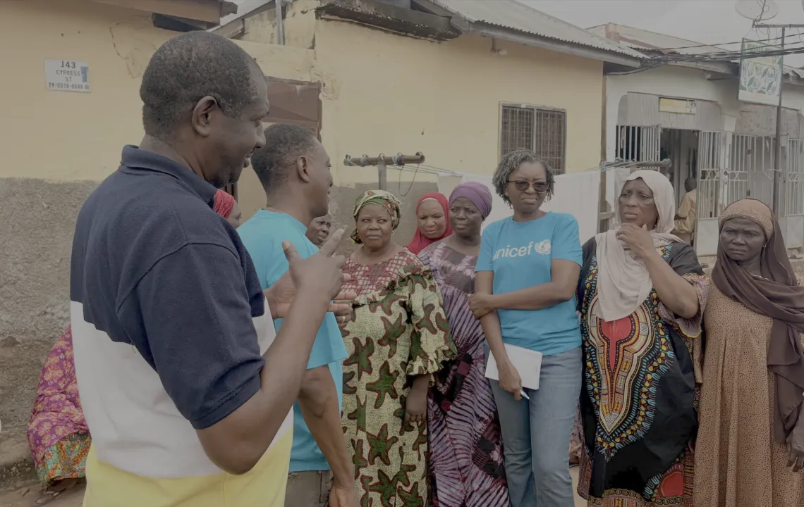 UNICEF Staff interacts with the members of the community on access to water.