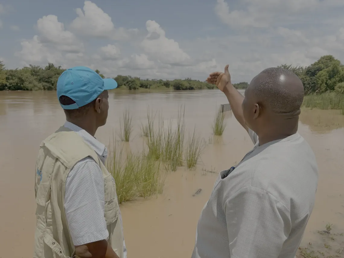 WASH Chief, Arnold Cole interacts with a community leader on water accessibility.