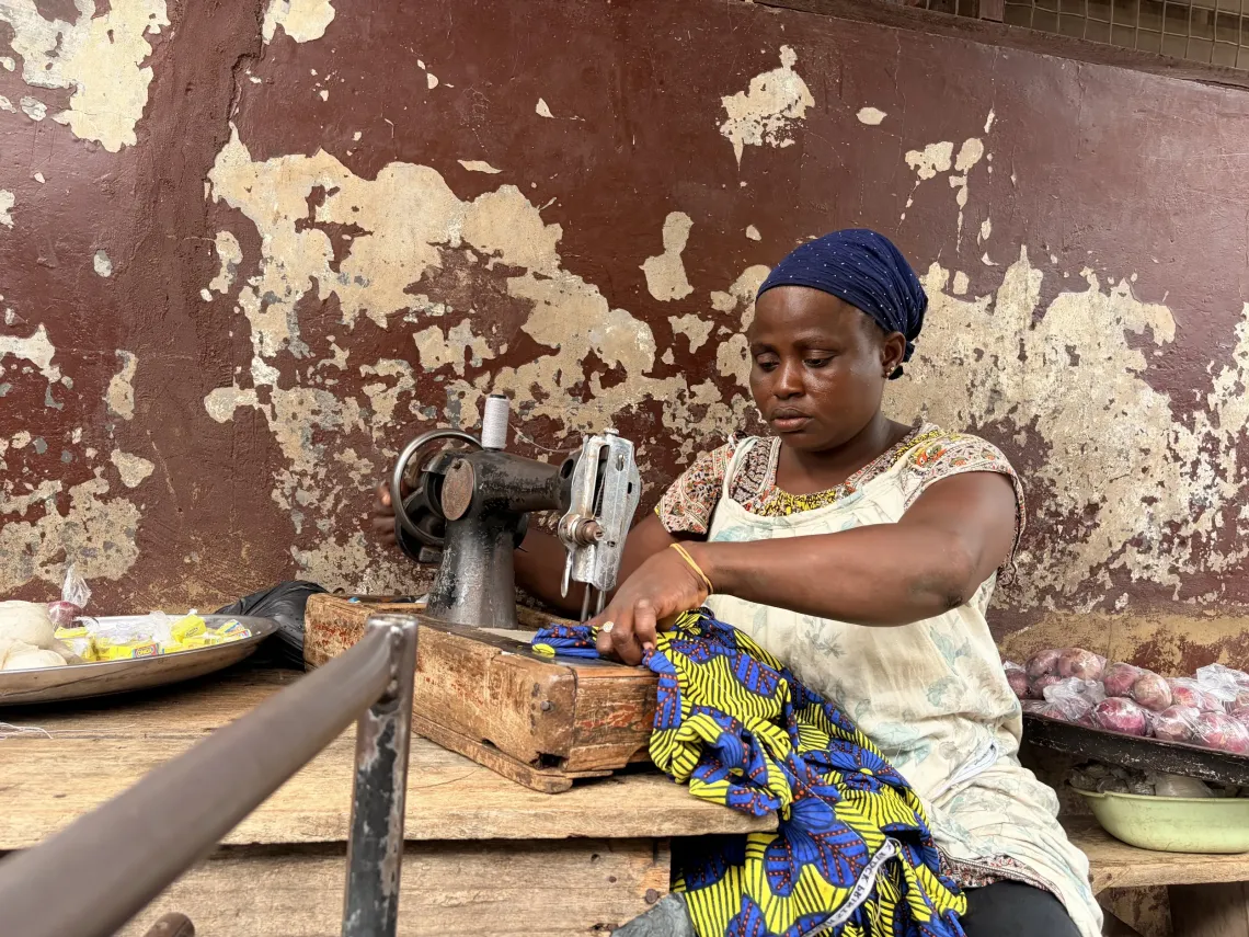 Ajara supplements her income through petty trading and tailoring at the Wa Central Market.