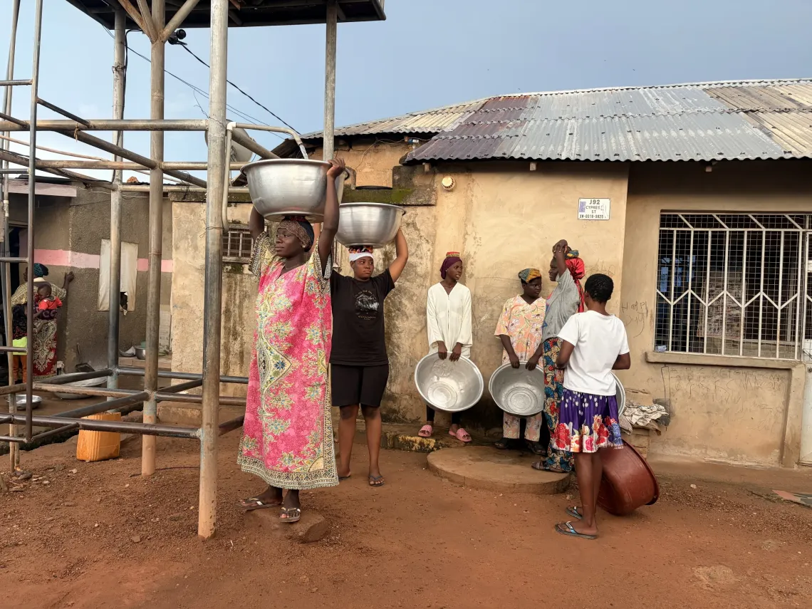 Many households in Sokpeyiri rely on public water points and transport water home daily. 