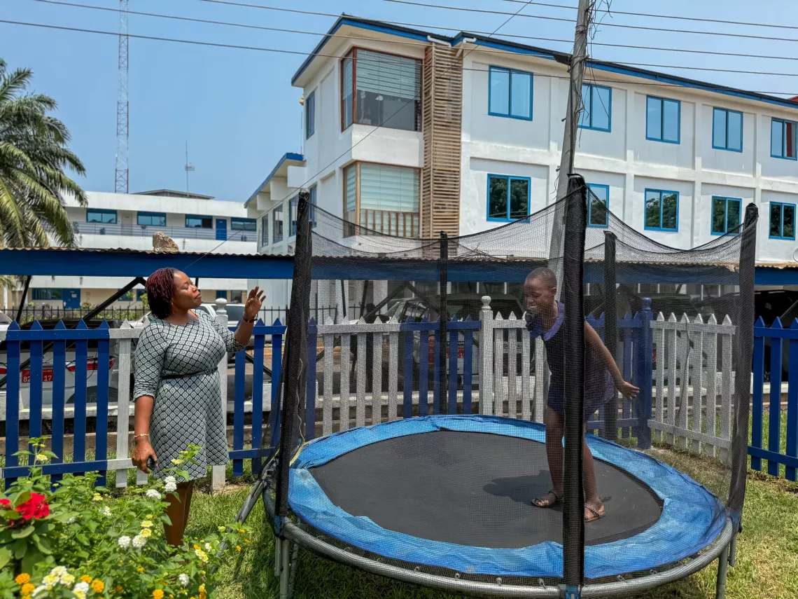 Miriam watches on as her daughter  Ewura Adjoa plays.