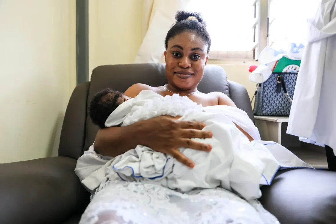 A mother breastfeeds her newborn at Tepa Government Hospital in Ghana's Ashanti Region.