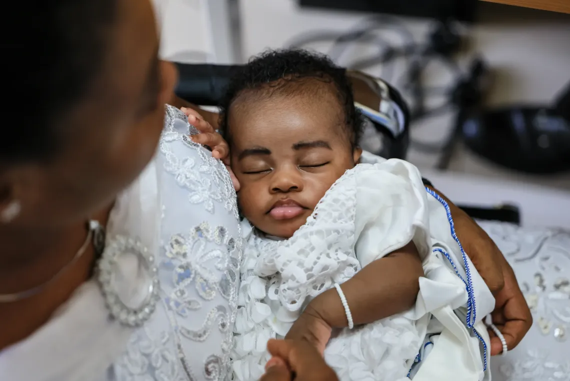 A baby sleeps during a breastfeeding and nutrition session for mothers and their newborns at the Tepa Government Hospital, Tepa, Ashanti Region, Ghana