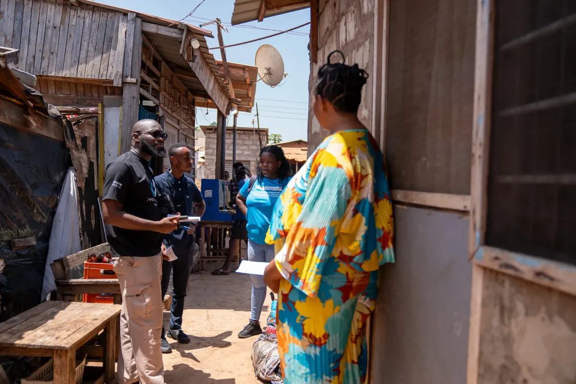 U-Reporters alongside Ghana Health Service staff engaging parents on the HPV vaccine. 