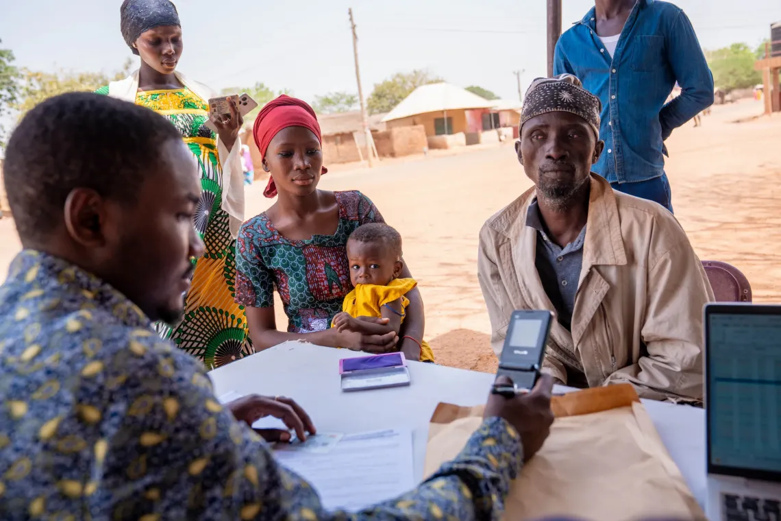 Abdul listens as one of his duaghters goes through the validation exercise 
