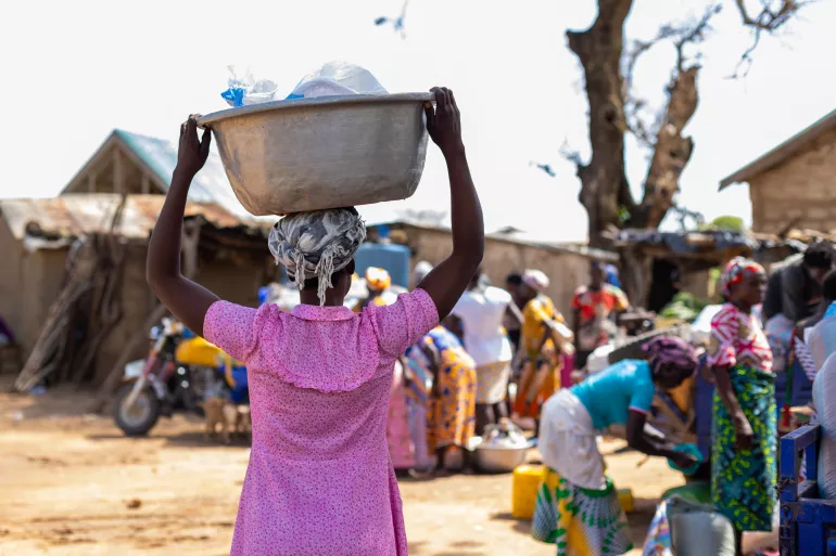 A Kayayoo carrying goods in one of the markets in Bolga.