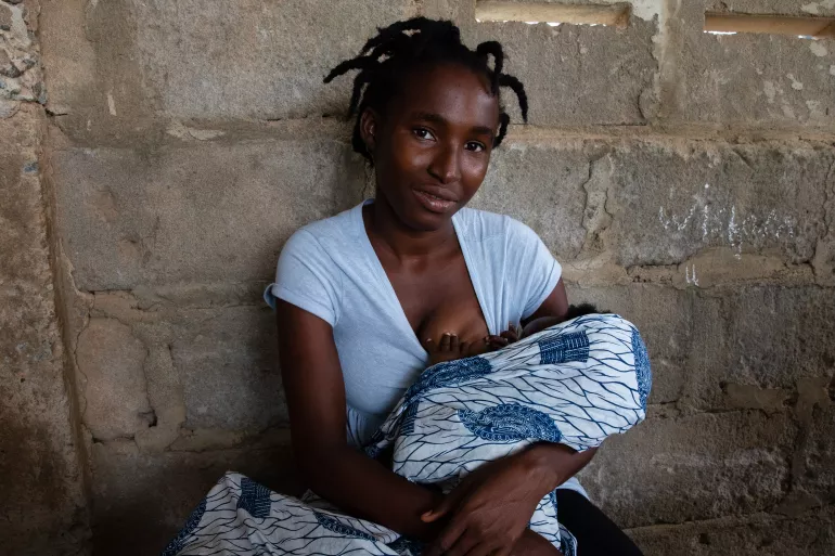 Sandra breastfeeding her baby.
