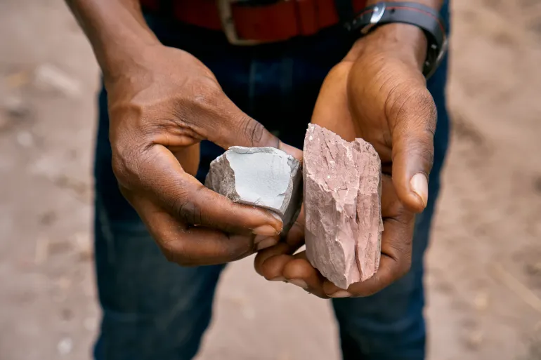 a man holding lead in his hands 