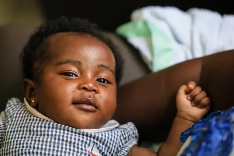 A baby gestures during a breastfeeding and nutrition session for mothers and their newborns at the Tepa Government Hospital, Tepa, Ashanti Region, Ghana.