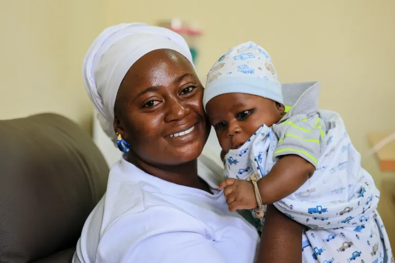 A mother and child are pictured during a breastfeeding and nutrition session for mothers and their newborns.