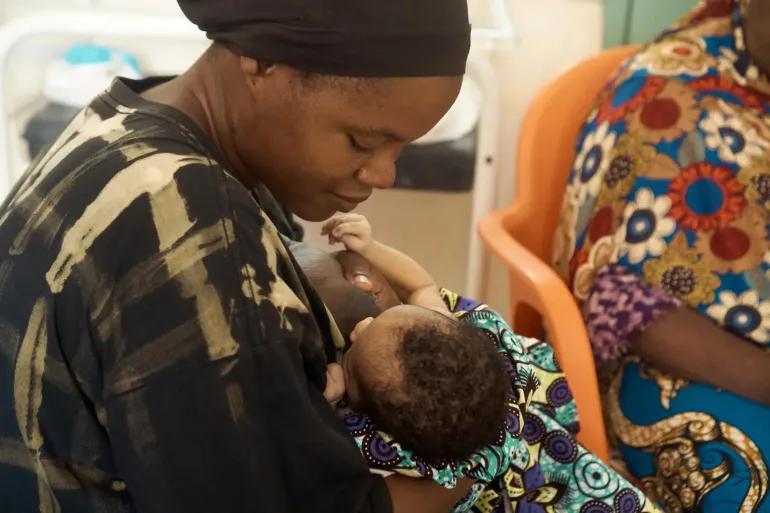 A mother breastfeeds her infant during a postnatal care session  at the Upper East Regional Hospital.