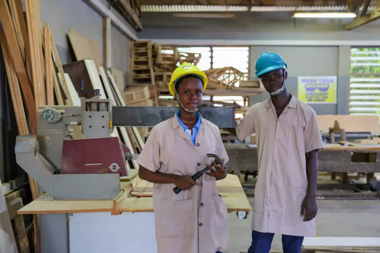 Young students pose for a photo in a TVET school 
