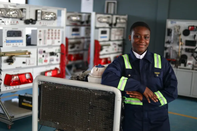 A photo with students during a tour of facilities 