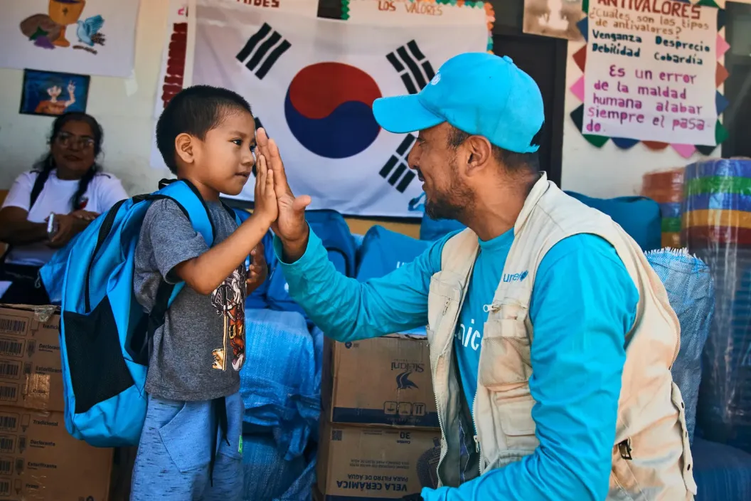 hild from the &ldquo;San Manuel&rdquo; community, receives a backpack with school materials.