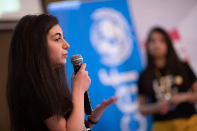 Emilya from team "A community with our hands" is presenting her group's project during the UPSHIFT bootcamp at Gyumri Technology Center.