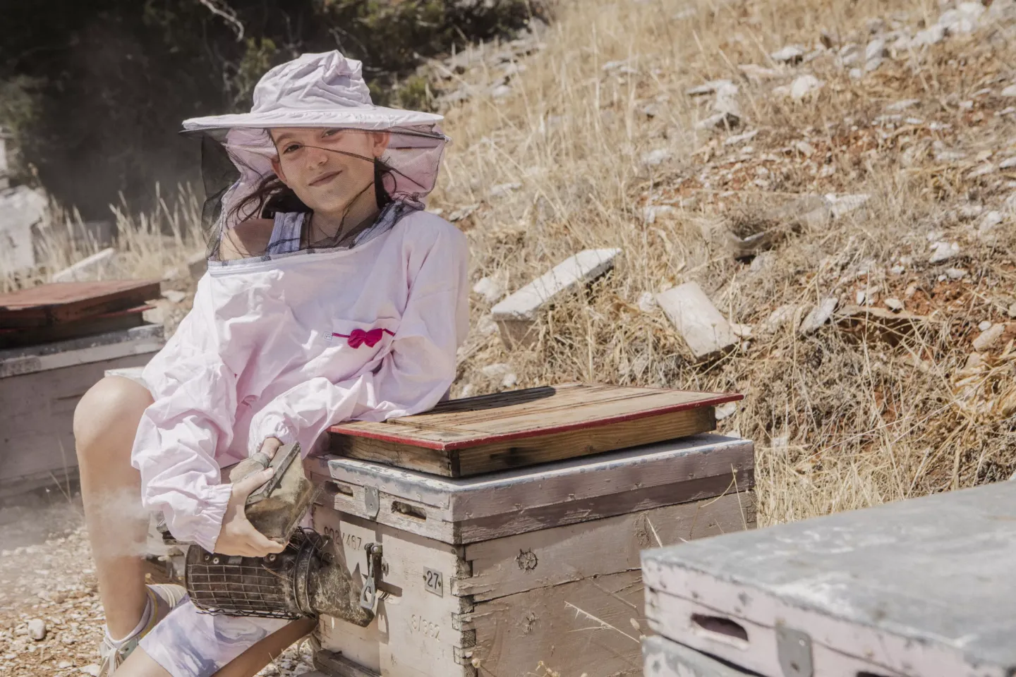 A portrait of Markela, 11, granddaughter of Markos Sakarikos, a beekeeper, living in Nea Makri.