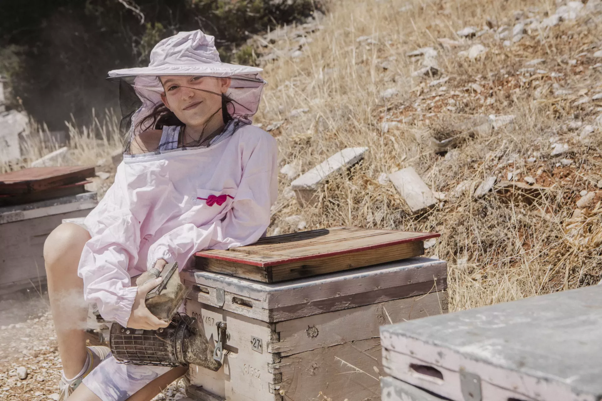 A portrait of Markela, 11, granddaughter of Markos Sakarikos, a beekeeper, living in Nea Makri.
