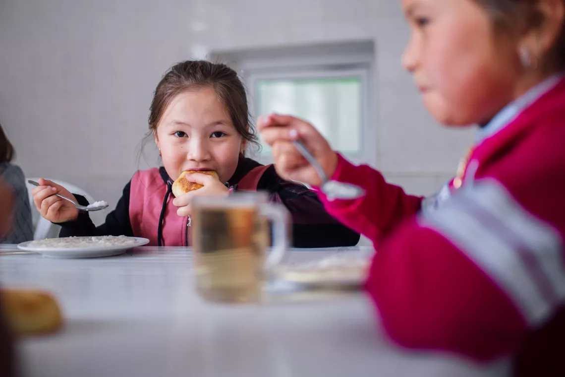 A girl eats a healthy lunch